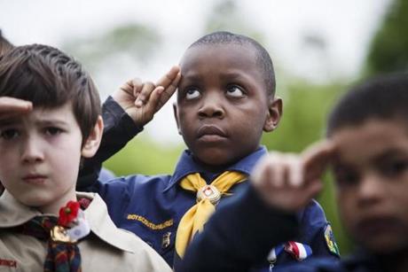Boston, MA - 5/29/2017 - Cub Scout Miles Gittens, 8, salutes during a Memorial Day parade in Boston, MA, May 29, 2017.(Keith Bedford/Globe Staff)
