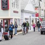 Commercial Stree in Provincetown, MA on Memorial Day. The street is usually crowded on Memorial Day but today it was relatively quiet save for some people rolling their suitcases down the tarmac. 05/29/17 Julia Cumes for the Boston Globe