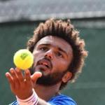 France's Maxime Hamou serves the ball to Uruguay's Pablo Cuevas during their tennis match at the Roland Garros 2017 French Open on May 29, 2017 in Paris. / AFP PHOTO / Eric FEFERBERGERIC FEFERBERG/AFP/Getty Images