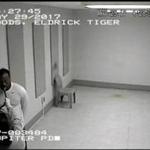 In this Monday, May 29, 2017, image made from a surveillance video provided by the Jupiter Police Department, Tiger Woods uses a breathalyzer at the Palm Beach County jail following his DUI arrest in Palm Beach County, Fla. Woods told the officers he had not been drinking, and two breath tests at the jail registered a 0.0 blood-alcohol level. Woods is to be arraigned July 5 in Palm Beach County Court. (Jupiter Police Department via AP)
