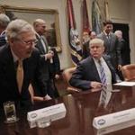 President Donald Trump, center, waits for Senate Majority Leader Mitch McConnell of Ky., left, and House Speaker Paul Ryan of Wis., right, to take their seats to begin a meeting with House and Senate Leadership in the Roosevelt Room of the White House in Washington, Tuesday, June 6, 2017. Also at the meeting are from left, Marc Short White House Director of Legislative Affairs for President Donald Trump, House Majority Leader Kevin McCarthy of Calif., National Economic Council chairman Gary Cohn and Senior adviser to President Donald Trump Jared Kushner. (AP Photo/Pablo Martinez Monsivais)
