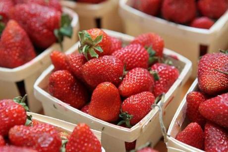 Local strawberry farmers say they will need some warmer and sunnier days for their crop to go from a mix of green, white, and red to a ripe red
