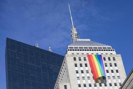 A pride flag hung from the Berkeley Building in Boston. 
