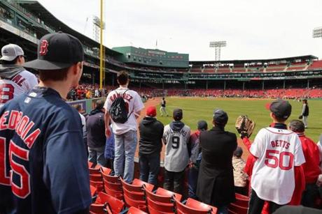 Boston-04/03/2017- Opening Day at Fenway Park- Red Sox played the Pirates- Fans in right field wait for long fly ball during batting practice. John Tlumacki/Globe staff(sports)
