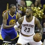 Golden State Warriors forward Kevin Durant (35) defends Cleveland Cavaliers forward LeBron James (23) during the second half of Game 3 of basketball's NBA Finals in Cleveland, Wednesday, June 7, 2017. (AP Photo/Tony Dejak)
