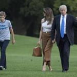 President Trump arrived back at the White House on Sunday, accompanied by his wife, Melania, and their son, Barron.