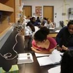 Students worked on a lab project in a sixth grade science class at Engineering & Science University Magnet Middle and High School in West Haven, Conn.