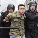 Russian police officers detained a participant of an unauthorized opposition rally in Moscow Monday.