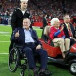 Former President George H.W. Bush (center) arrived at midfield for the coin toss before Super Bowl LI in February.