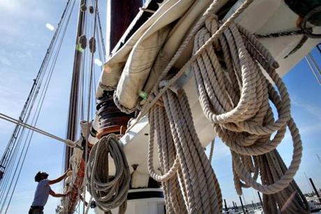 Deckhand Aaron Funk worked on the Spirit of South Carolina docked in Salem Harbor in Salem Wednesday. 

