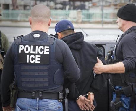 In this photo from February and released by US Immigration and Customs Enforcement showed people being arrested during a targeted enforcement operation in California.
