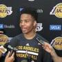Markelle Fultz, center, speaks with reporters after his private workout with the Los Angeles Lakers at NBA basketball team's training complex Thursday, June 15, 2017, in El Segundo, Calif. The University of Washington guard could be the No. 1 pick in the NBA draft by the Boston Celtics, or he could be available to the Los Angeles Lakers with the second overall pick. (AP Photo/Greg Beacham)