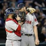 Boston Red Sox catcher Sandy Leon, left, talks with starting pitcher Chris Sale during the second inning of a baseball game against the Chicago White Sox Tuesday, May 30, 2017, in Chicago. (AP Photo/Charles Rex Arbogast)