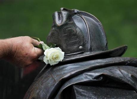 A rose was placed on the memorial wall during today?s ceremony for the Boston firefighters killed at the Hotel Vendome fire.
