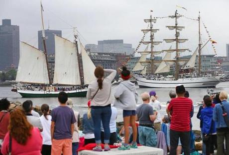 East Boston-06/17/2017- The tall ships parade of sails in Sail Boston 2017 as seen from Lo Presti Park in East Boston. People watch a schooner(left) and the Guayas pass. John Tlumacki/The Boston Globe(metro)
