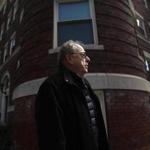 Former United Press International reporter Michael Widmer, who covered the January 1969 murder of Jane Britton, stood outside her apartment building on University Road in Cambridge, near Harvard Square. Now he is fighting to see law enforcement records about the unsolved case.