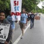 Dairy farm workers and activists marched to a Ben & Jerry?s  factory in Waterbury, Vt.