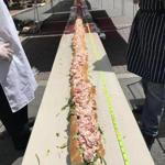 Measuring 159-feet and 6-inches, the mammoth lobster roll was displayed in Portsmouth, N.H. 