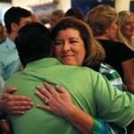 Republican candidate for Congress Karen Handel was hugged Monday during a campaign stop in Roswell, Ga.