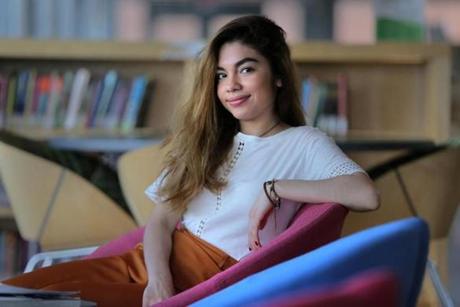 Maybelline Perez Villatoro, valedictorian at East Boston High School, paused at the East Boston Public Library for a portrait.
