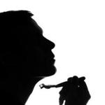 Young man shaving in the morning - silhouette
