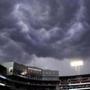 Storm clouds roll over Fenway Park, prior to heavy rain and lightning, prior to baseball game between the Boston Red Sox and Minnesota Twins in Boston, Tuesday, June 27, 2017. The start of the game was delayed due to weather. (AP Photo/Charles Krupa)