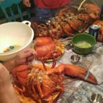 After photos of 15-pound lobster went viral, Christopher Stracuzza served it up for a feast with friends.
