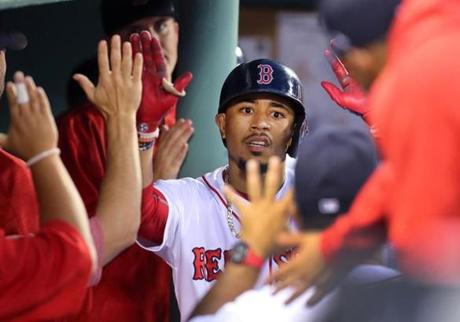  Boston-06/29/2017- Boston Red Sox vs Twins- Sox Mookie Betts celebrates his 4th inning solo homer in the Sox dugout. ohn Tlumacki/The Boston Globe(sports)
