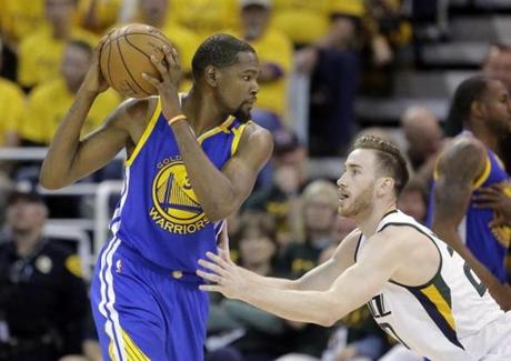 Utah Jazz forward Gordon Hayward (20) guards Golden State Warriors forward Kevin Durant (35) in the second half during Game 4 of the NBA basketball second-round playoff series Monday, May 8, 2017, in Salt Lake City. The Warriors completed a second-round sweep of the Utah Jazz with a 121-95 victory. (AP Photo/Rick Bowmer)
