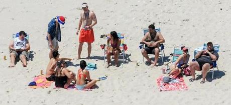 New Jersey Governor Chris Christie (right) used the beach with his family and friends at the governor?s summer house at Island Beach State Park in New Jersey. 
