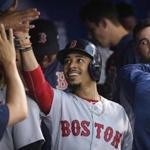 TORONTO, ON - JUNE 30: Mookie Betts #50 of the Boston Red Sox is congratulated by teammates in the dugout after scoring a run in the fifth inning during MLB game action against the Toronto Blue Jays at Rogers Centre on June 30, 2017 in Toronto, Canada. (Photo by Tom Szczerbowski/Getty Images)