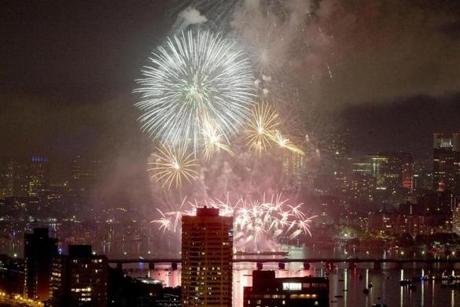 Fourth of July fireworks exploded over the Charles River and Esplanade, as seen from the roof of Boston University at 33 Harry Agganis Way in 2015.
