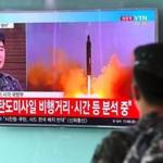 TOPSHOT - A South Korean soldier watches a television news showing file footage of a North Korean missile launch, at a railway station in Seoul on July 4, 2017. North Korea launched a ballistic missile on July 4, the South's military said, just days after Seoul's new leader Moon Jae-In and US President Donald Trump focused on the threat from Pyongyang in their first summit. / AFP PHOTO / JUNG Yeon-JeJUNG YEON-JE/AFP/Getty Images