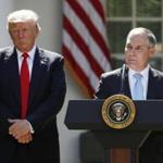 President Donald Trump listens as Environmental Protection Agency Administrator Scott Pruitt speaks about the U.S. role in the Paris climate change accord in the Rose Garden of the White House on June 1.