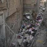 An Iraqi Special Forces soldier walked on Wednesday among on clothes left behind by fleeing civilians as Iraqi forces continue their advance against Islamic State militants in the Old City of Mosul.