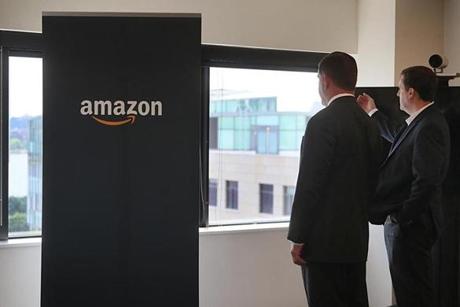 Boston Mayor Martin Walsh and State Representative Jay Livingstone looked at the view to Boston from the Amazon Cambridge offices. 

