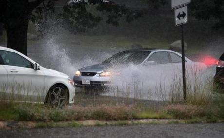 Acton MA: July 12, 2017: Cars were forced to forge some standing water on Concord Road in Acton after a heavy rain storm passed through the area this evening. (Globe Staff Photo/ Jim Davis) 

