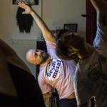 Participant Michael Tartamella went through poses in Metal Yoga class at the Satanic Temple in Salem.