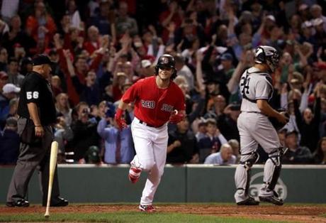 Boston, MA - 7/14/2017 - (9th inning) Boston Red Sox left fielder Andrew Benintendi (16) heads to first base after drawing a bases loaded walk that scored the game winning run in the bottom of the ninth inning. The Boston Red Sox host the New York Yankees in the first of a three game series at Fenway Park. - (Barry Chin/Globe Staff), Section: Sports, Reporter: Peter Abraham, Topic: 15Red Sox-Yankees, LOID: 8.3.3072880654.
