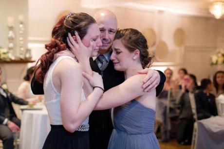Pete Otto danced with his daughters, Jessica and Megan, in February. 
