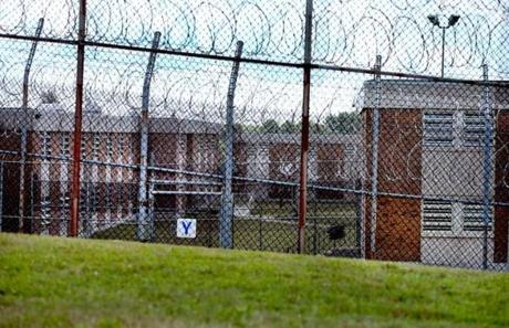 In this photo taken Tuesday, razor wire lined the perimeter of the Bridgewater State Hospital grounds.
