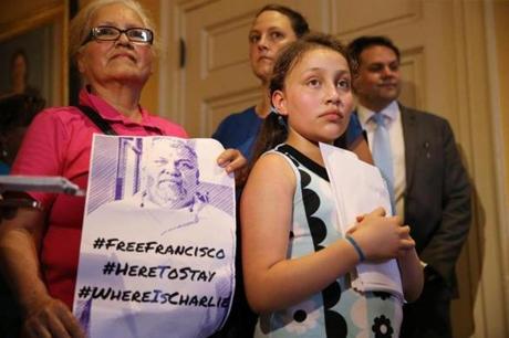 Melanie Rodriguez, 10, accompanied by her grandmother Jessie Rodriguez, waited to deliver a letter in the Governors office following a rally for the release of her father, MIT janitor Francisco Rodriguez at the State House Thursday.
