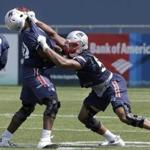 New England Patriots defensive end Derek Rivers, left, defensive tackle Adam Butler, center, and defensive end Deatrich Wise, right, perform field drills during NFL football practice, Tuesday, June 13, 2017, in Foxborough, Mass. (AP Photo/