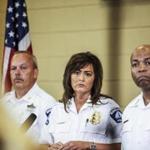 Minneapolis police chief Janee Harteau, center, stands with police inspector Michael Kjos, left, and assistant chief Medaria Arradondo during a news conference Thursday, July 20, 2017, Minneapolis. It was the first time she appeared publicly since the police shooting death of Justine Damond on Saturday. (Maria Alejandra Cardona/Minnesota Public Radio via AP)