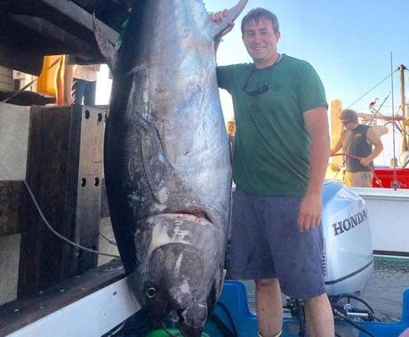 N.H. Trooper Nick Cyr with his 646-pound tuna. 
