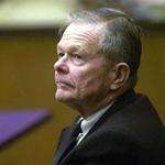 Former priest John Geoghan listens to testimony during his trial for the indecent assault and battery on a child under fourteen, at Middlesex Superior Court in 2002.