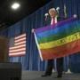 Donald Trump held a rainbow flag he borrowed from a supporter last year.