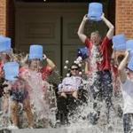 Governor Charlie Baker, right center, participated in the Ice Bucket Challenge with its inspiration, Pete Frates, center. 