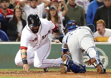Boston MA 07/29/17 Boston Red Sox Sandy Leon avoids the tag from Kansas City Royals Drew Butera to win the game during tenth inning action at Fenway Park. (Matthew J. Lee/Globe staff) topic: reporter: 
