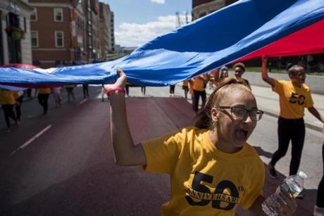 Kayleen Aponte chanted during the 50th annual Puerto Rican Festival parade, which began at the Hynes Convention Center on Sunday.

